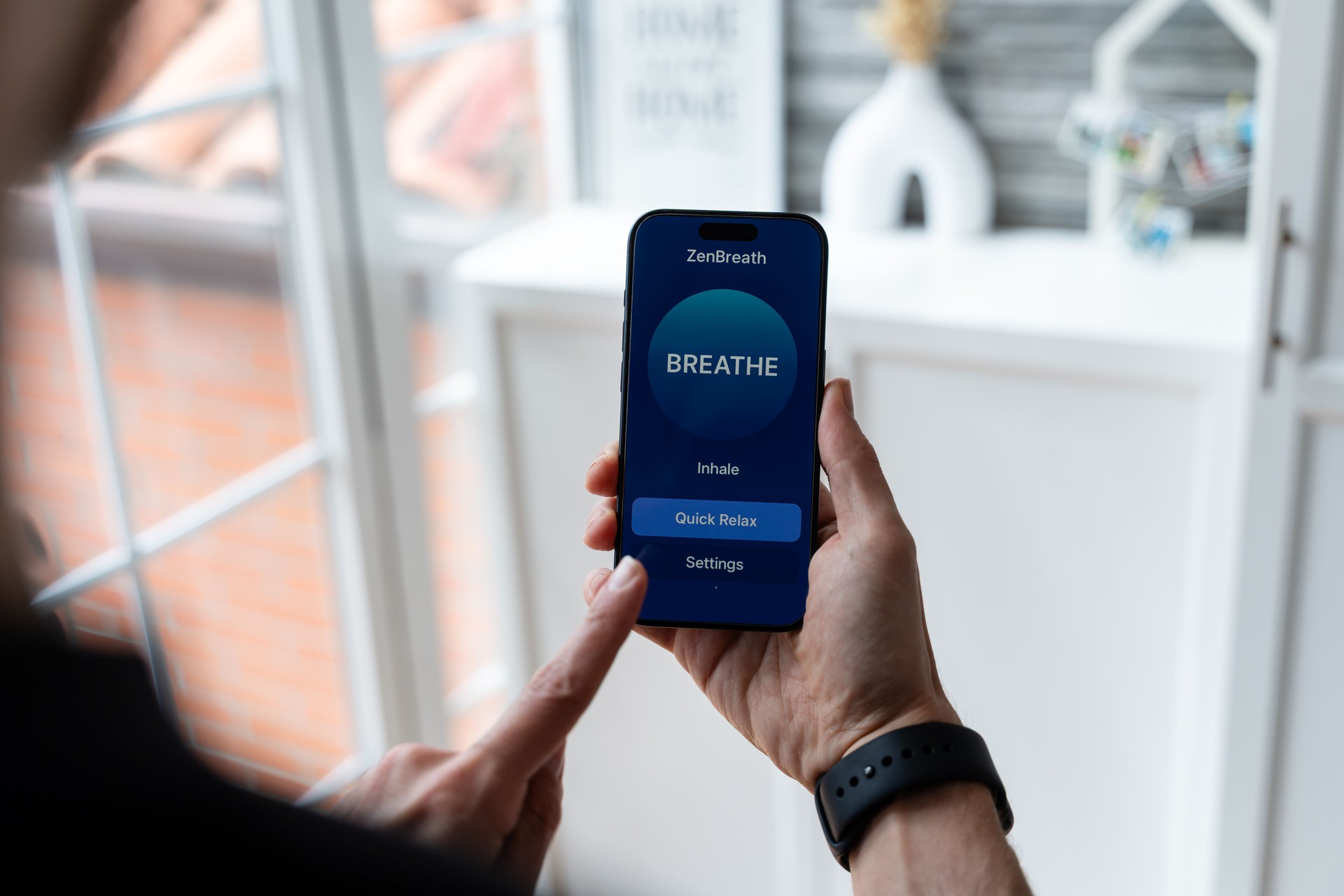 Man using a breathing exercise app on smartphone for relaxation and mindfulness