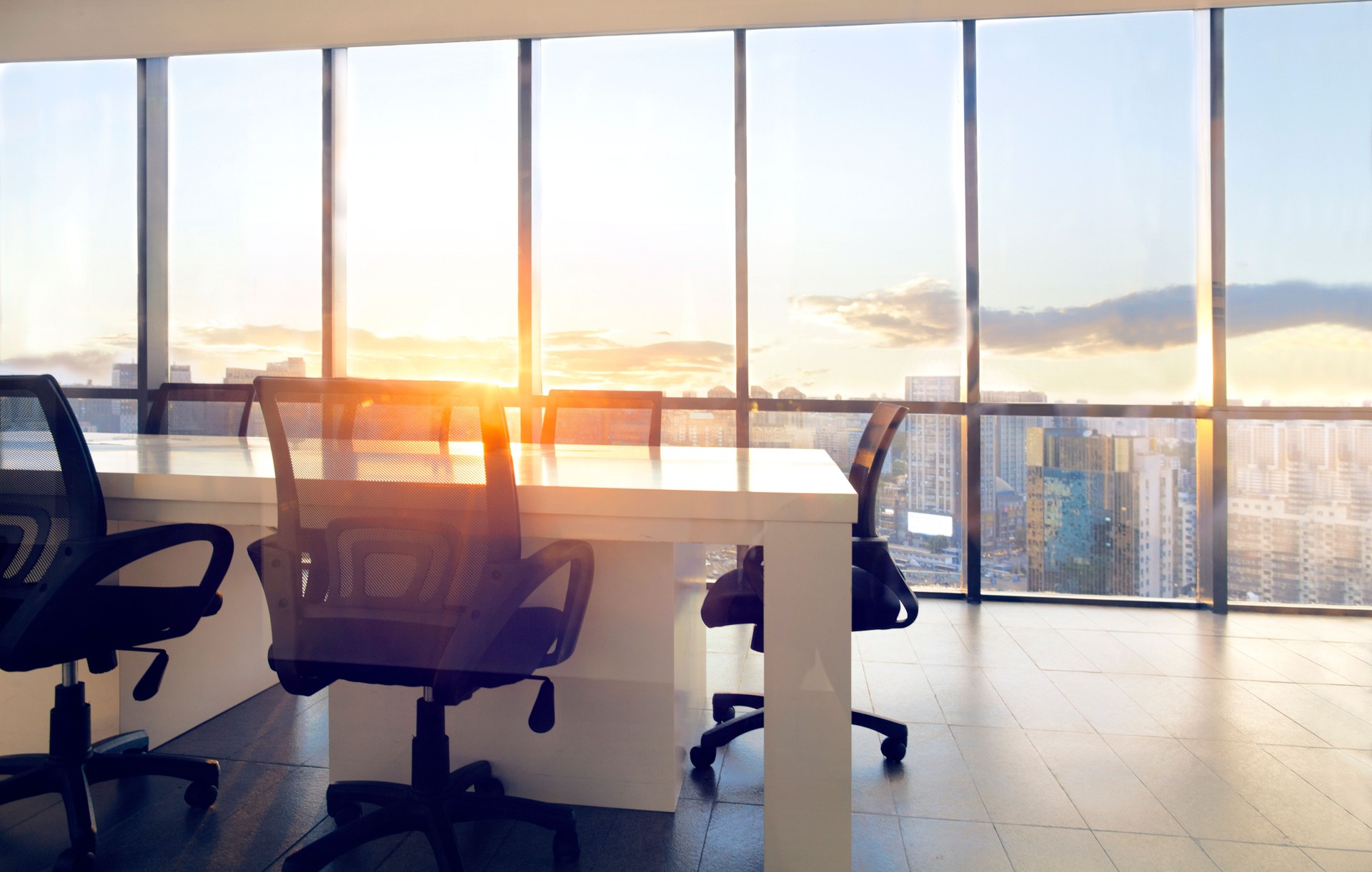 View of office conference room with sunset light in windows